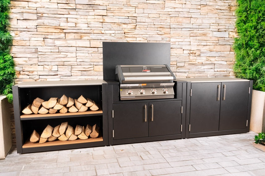 Outdoor kitchen island with BBQ cabinet, storage units and wood log shelving.