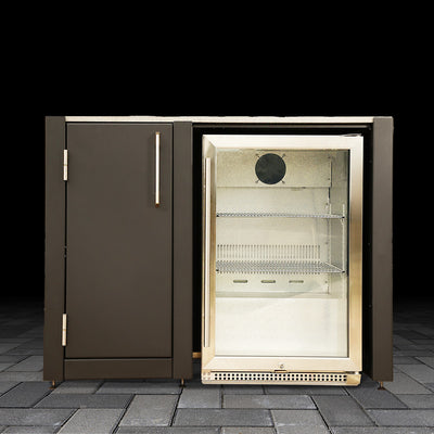 Outdoor refrigerator with glass door on a stone patio