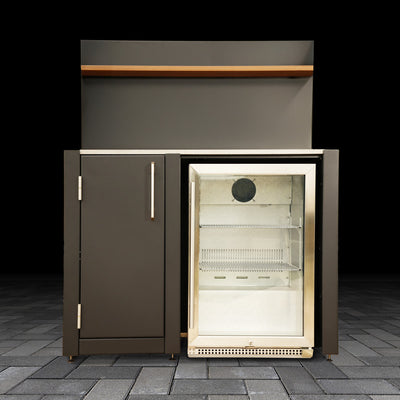 Outdoor kitchen refrigerator on a stone patio