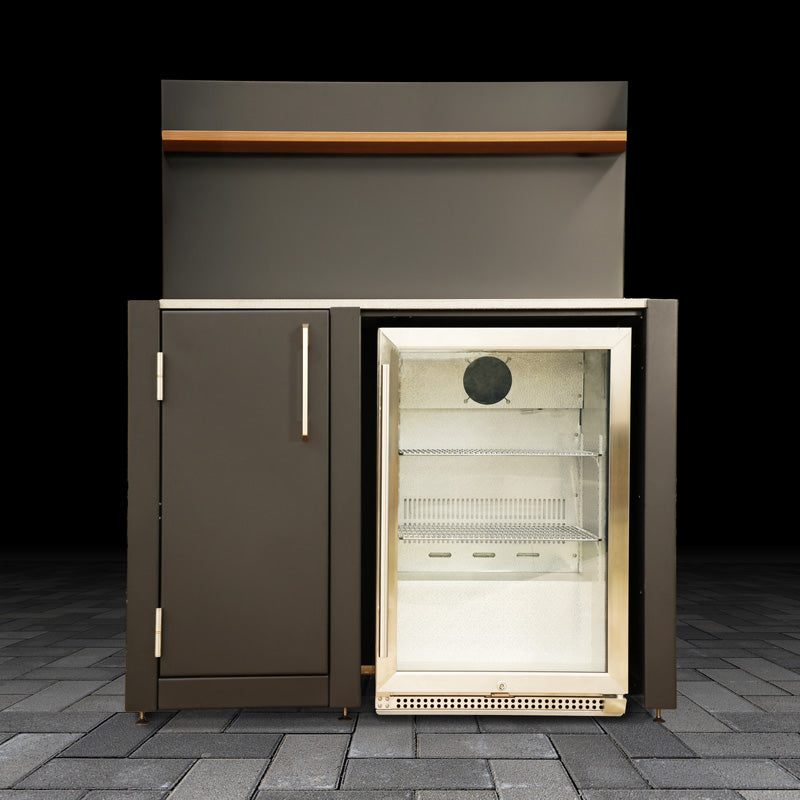 Outdoor kitchen refrigerator on a stone patio