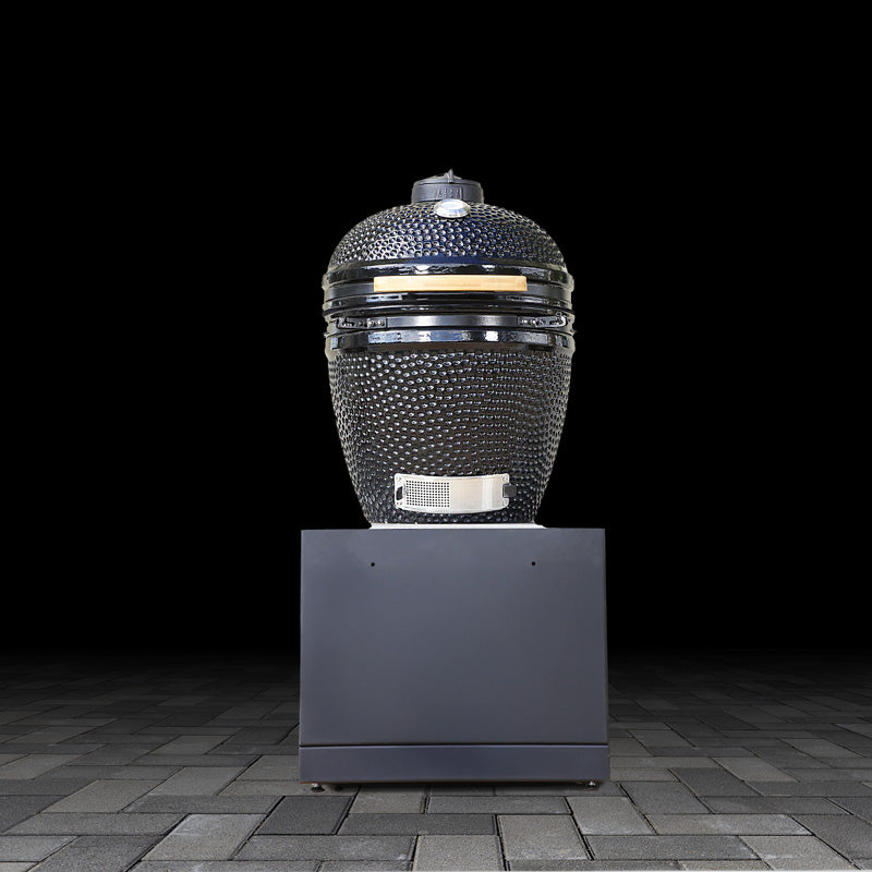 Outdoor kamado grill base unit on a black background