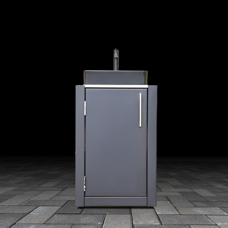 Black outdoor kitchen cabinet with sink on a dark background