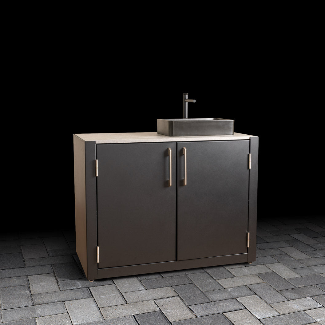 Outdoor Sink Unit with Dual-Doors, a matte black basin, stainless steel handles, and a ceramic tile worktop for luxury outdoor kitchens.