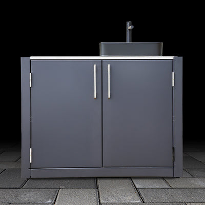 Black outdoor kitchen cabinet with sink on a black background