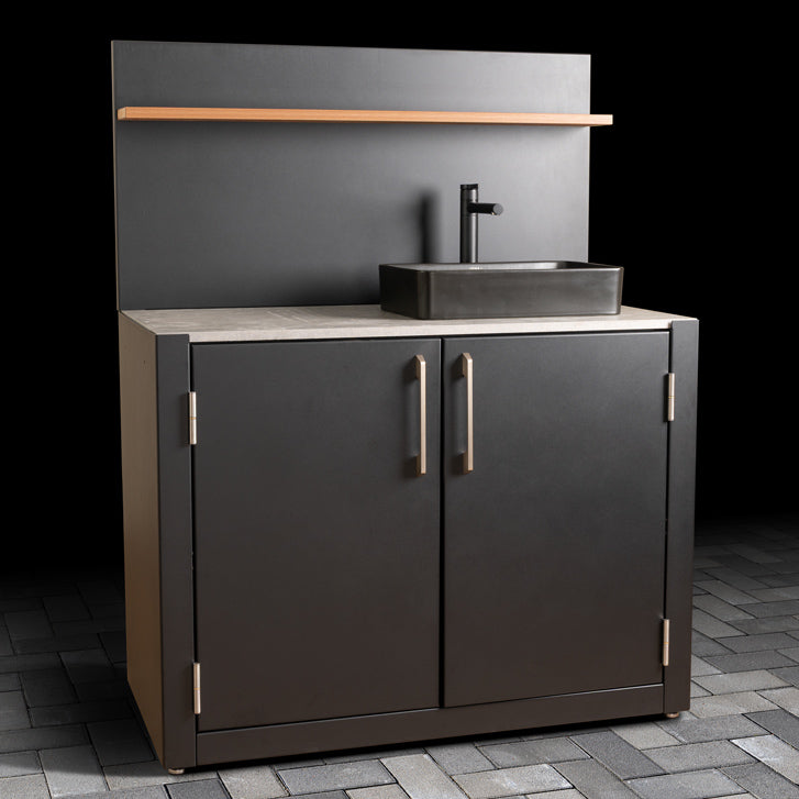 Outdoor Sink Unit with Dual-Doors, matte black basin, stainless steel handles, ceramic tile worktop, back panel and composite wood effect shelf. 