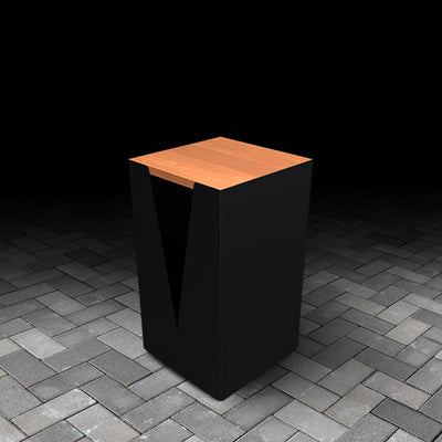 Black and composite wood-effect stool on a dark concrete floor